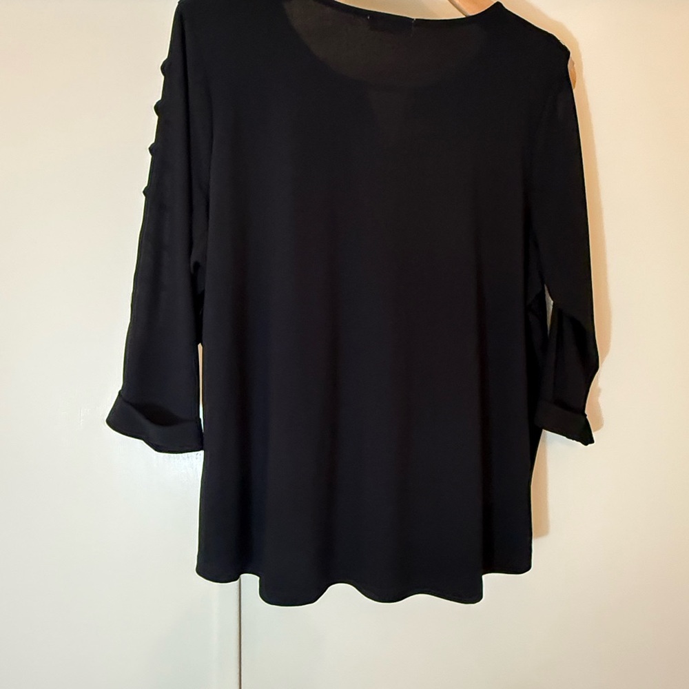 89th and Madison Black Blouse with Cut-Out Sleeve Design. Crystals along throat